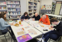 Participants playing the "What If" game in Baiso, Italy, May 2025